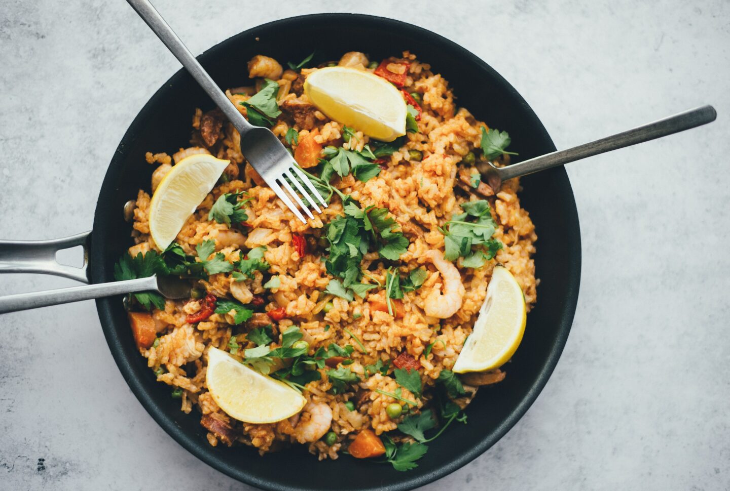 rice bake with peas seafood and lemon serve